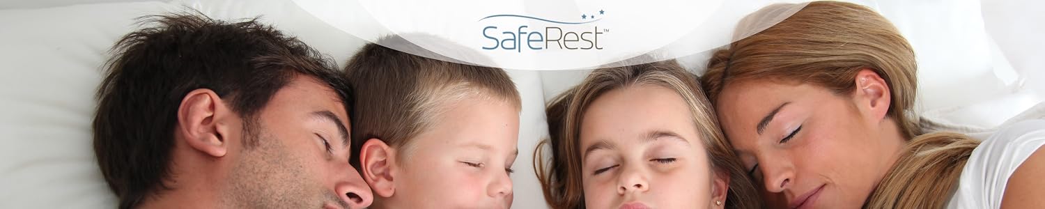 Family asleep on a protected mattress